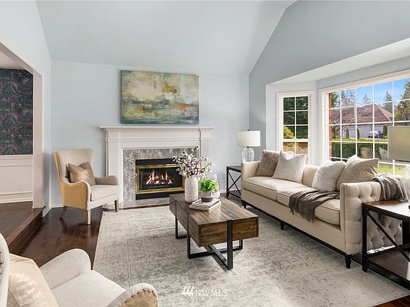 A beautiful fireplace with mantle adorns the formal living room. 