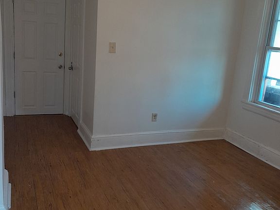 Front door entrance and bathroom. this area could be used as a bedroom.