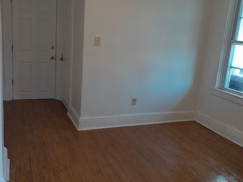Front door entrance and bathroom. this area could be used as a bedroom.