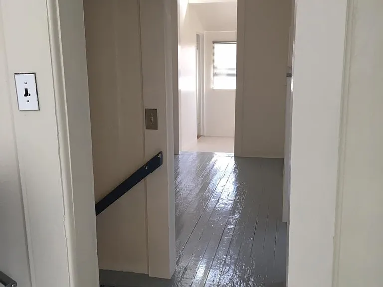 Central staircase from unit's private entrance
