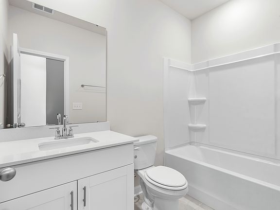 A full bathroom is located next to the secondary bedrooms.