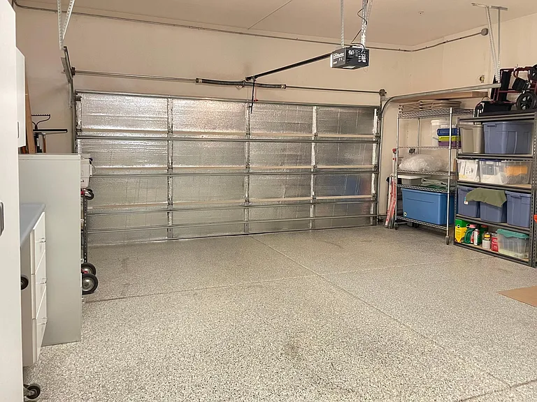 Spacious & insulated two-car garage with convenient extra refrigerator freezer!