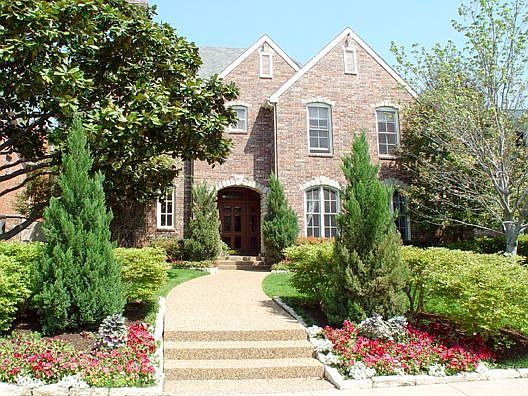 Beautiful traditional home with lush landscaping