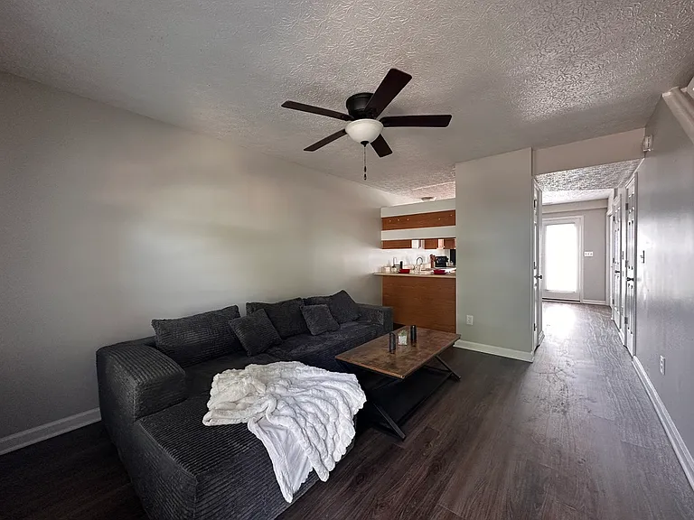 Living room - Updated plank flooring, freshly painted.