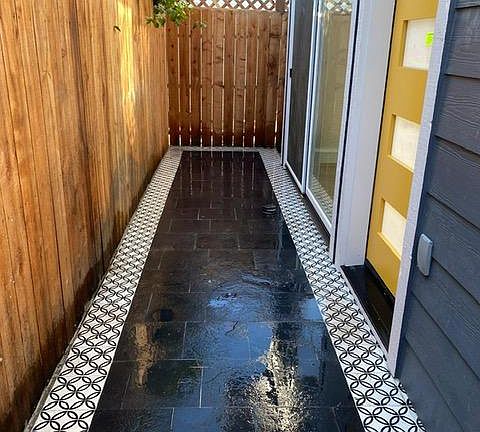 Yellow door entrance and front patio