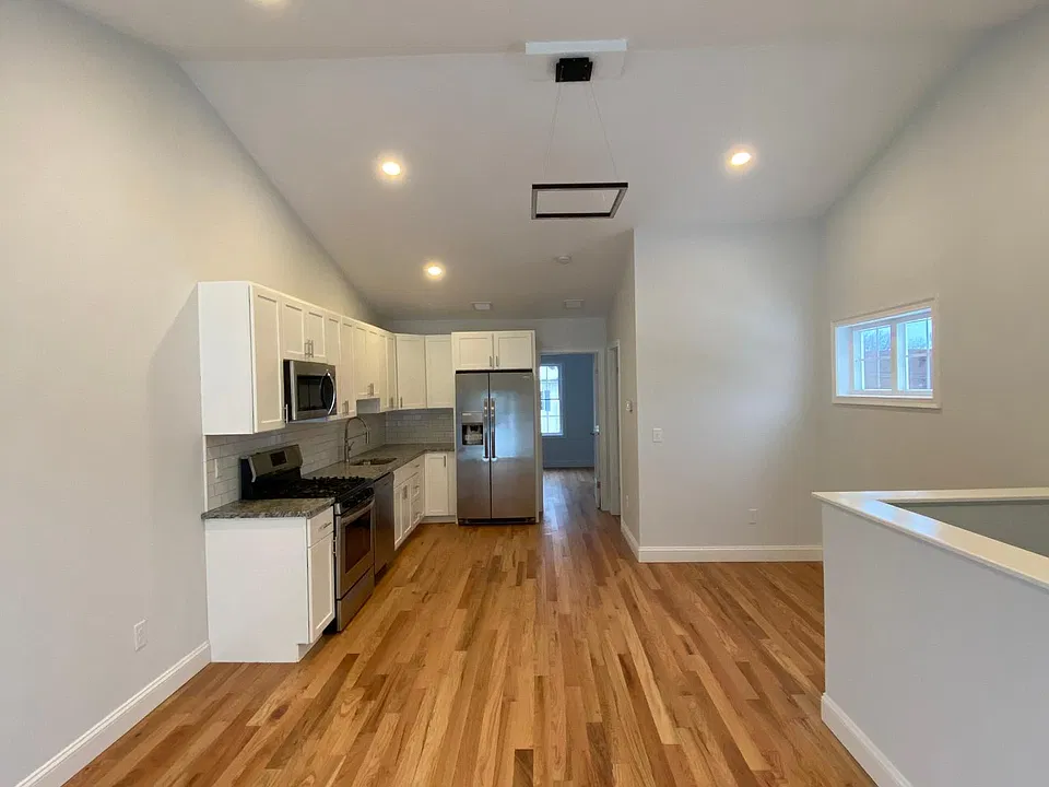 NATURAL OAK FLOORING AS SEEN IN UNIT 7