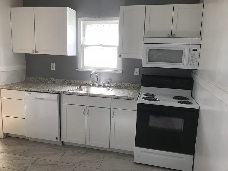 Kitchen- Dishwasher, electric stove, microwave, refrigerator.