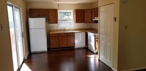 Open kitchen with hardwood floors - 1015 Holley Ln