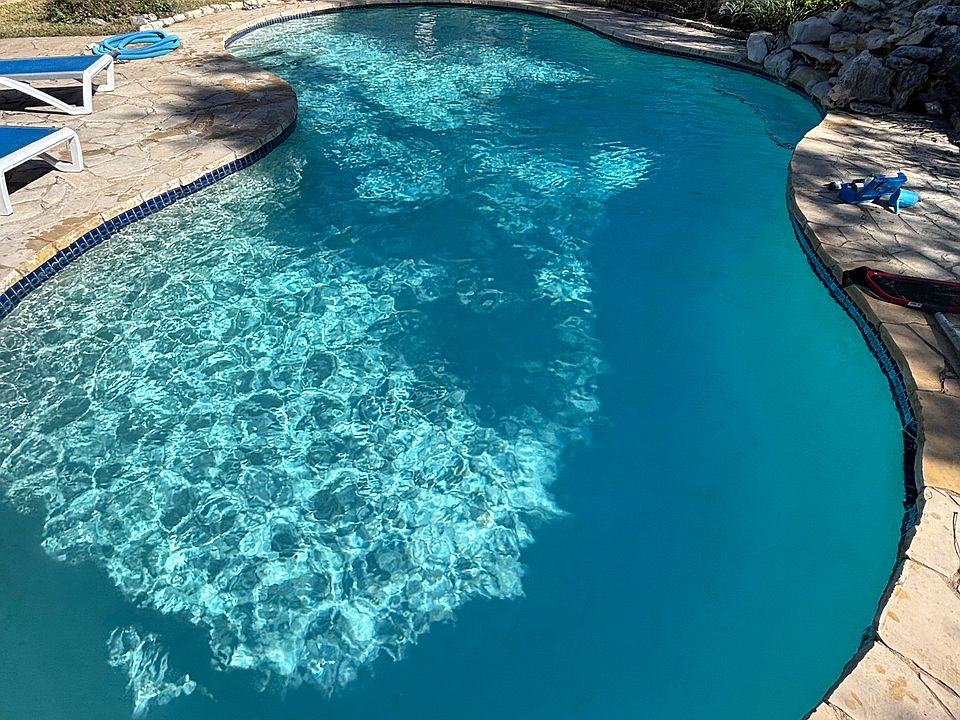 yard with pool , hot tub and fire pit