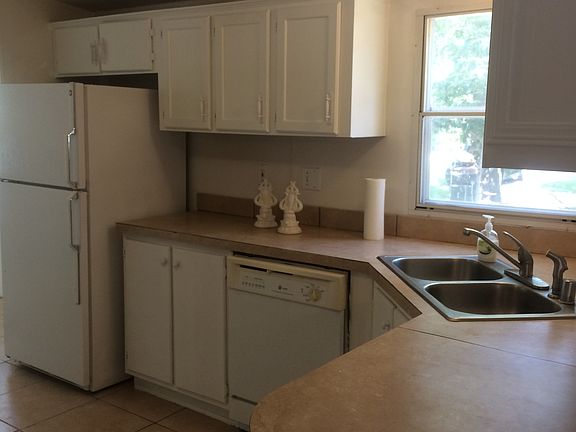 Large kitchen with tile floor