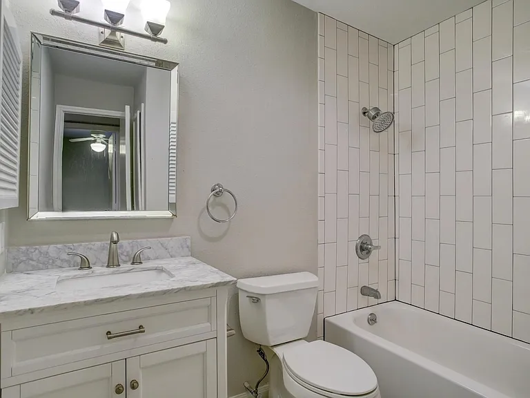 Contemporary full bath #1 with updated features and tons of storage.