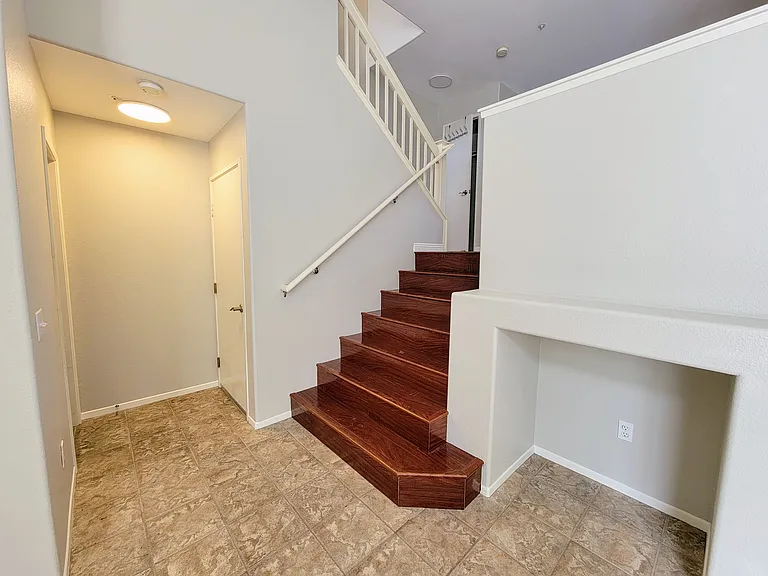 stairs to the dining room and kitchen