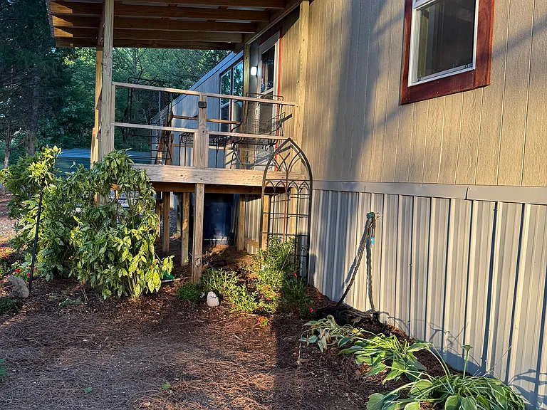 View of front porch and landscaping.