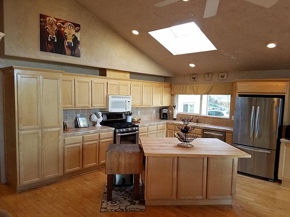 Kitchen with island and stainless steel/gas stove