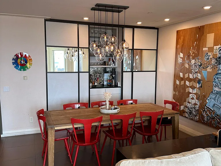 Dining room with California Closets built-ins, including bar area and storage