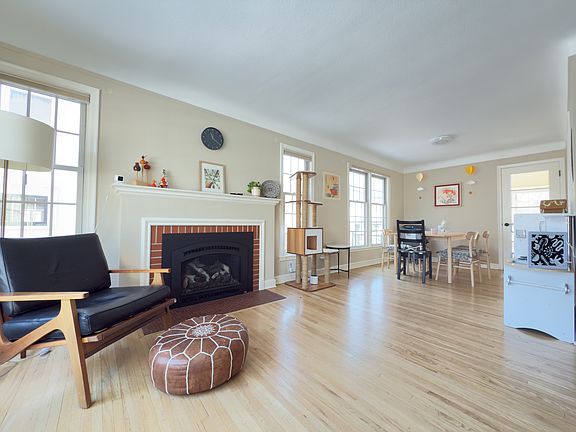 living room with ample light and newly added gas insert fireplace