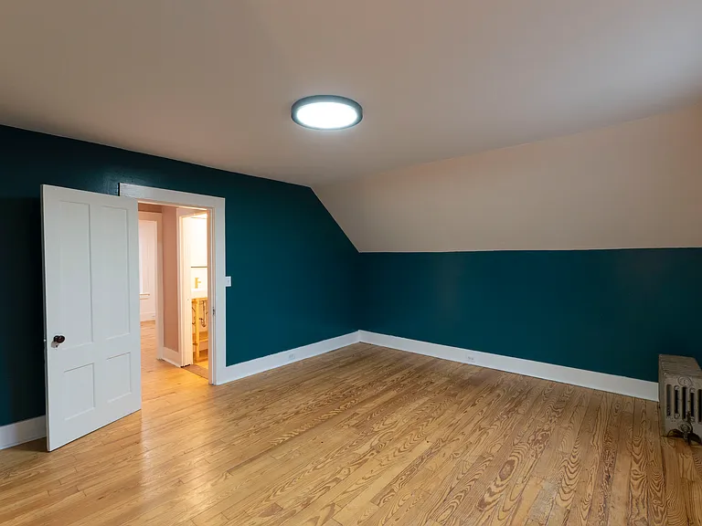 The large bedroom looking back to the stair landing