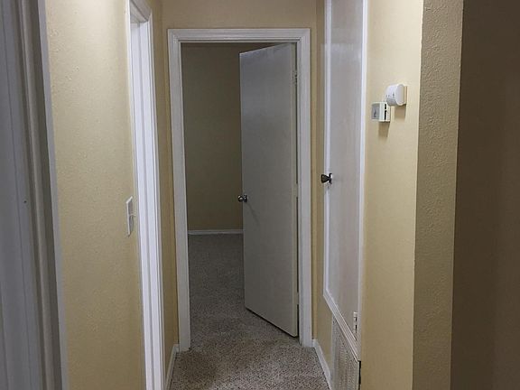 Hallway to bathroom and bedrooms
