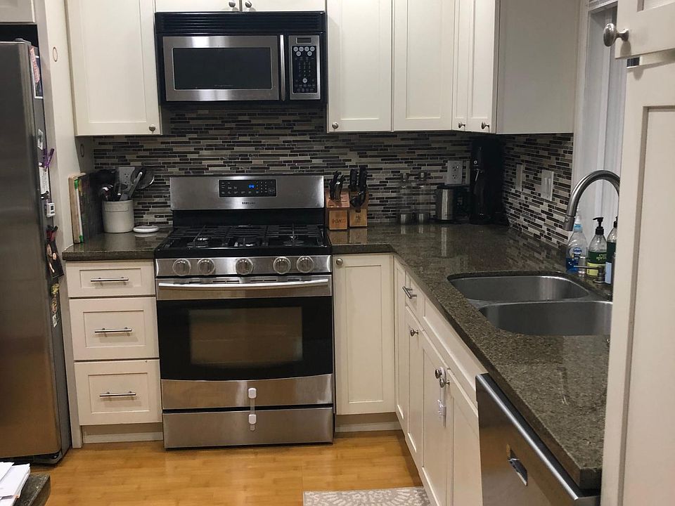 Open kitchen, stainless steal appliances and breakfast bar