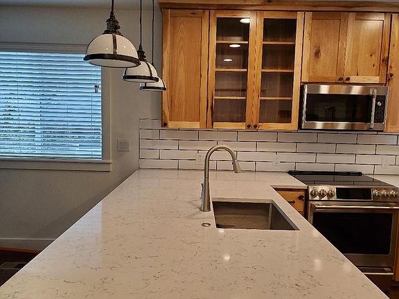 quartz counters, deep stainless steel kohler kitchen sink