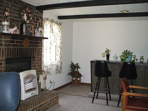 Fireplace and Bar in "L" shaped family room.