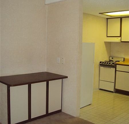 livingroom table and kitchen entrance