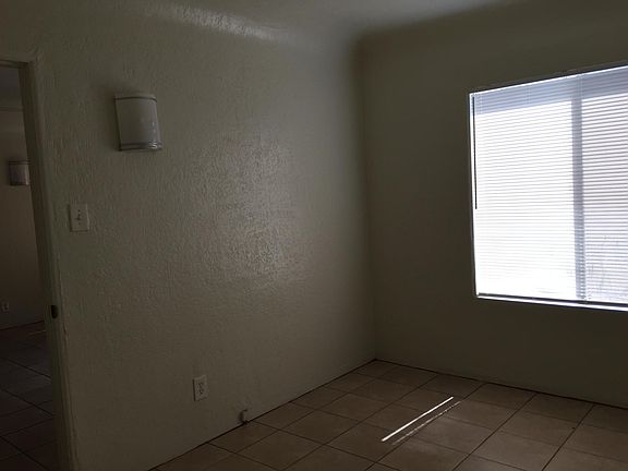 Fresh coat of paint throughout apartment with new tile.