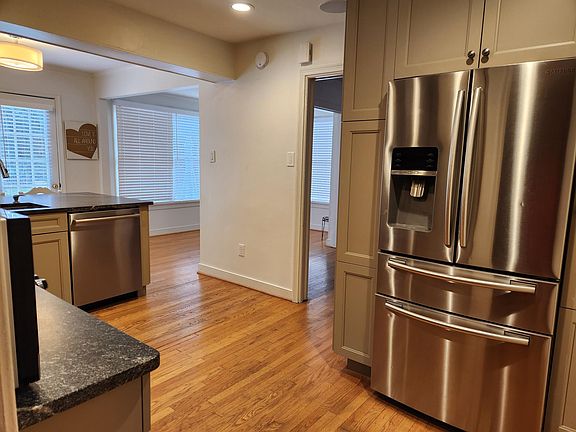 Kitchen and sun room. Bosch ultra quiet dishwasher, Samsung 4 door refrigerator; custom cabinets.