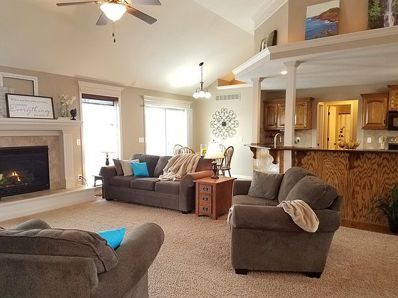 Upstairs living room, breakfast nook, kitchen, and sliding doors to deck