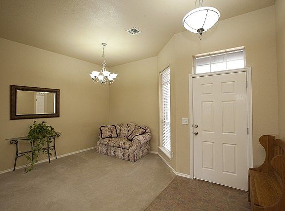 Entry opens to living and great rooms