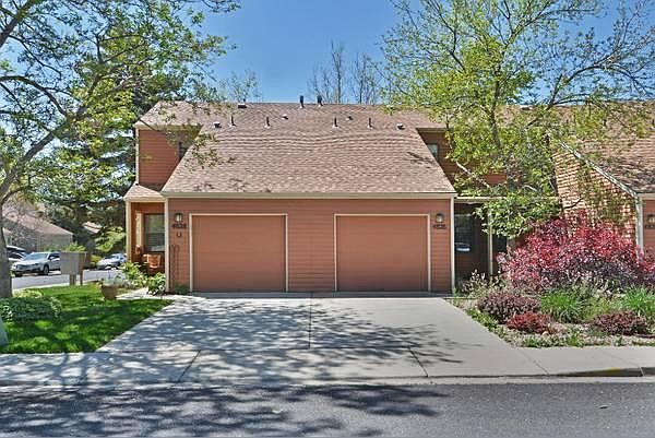 Front of townhome (see right side of driveway and garage)