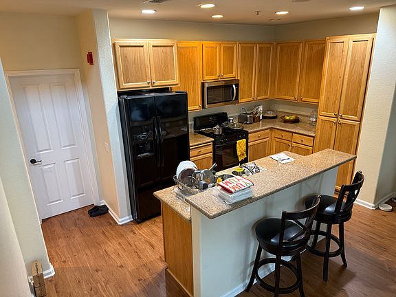 Kitchen furnished with Refer, range, microwave, dishwasher, disposal