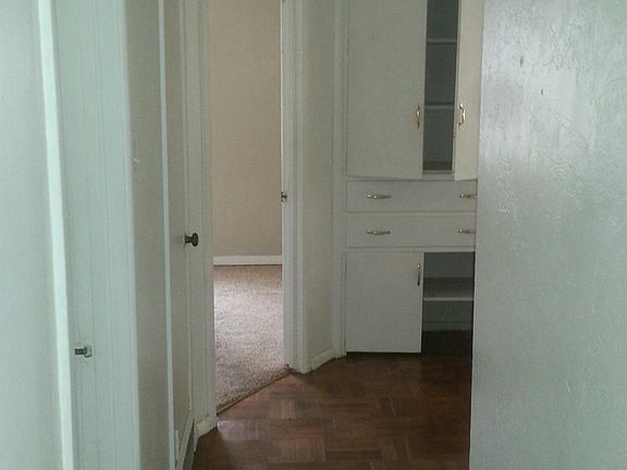 Hallway with Linen Closet to Enter Into Two Bedrooms, Bath a