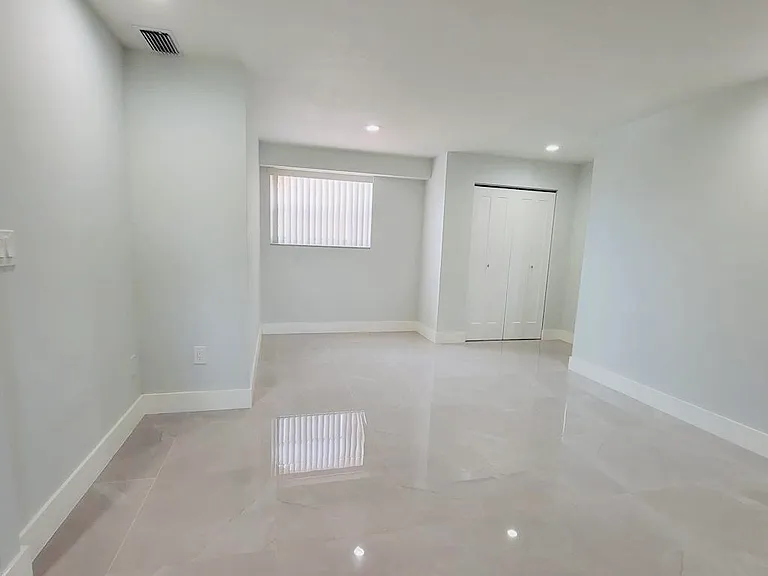 Living room with extra closet by entrance