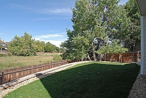 The patio and yard look out to open space.
