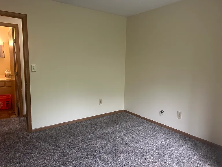 Bedroom across the full bathroom