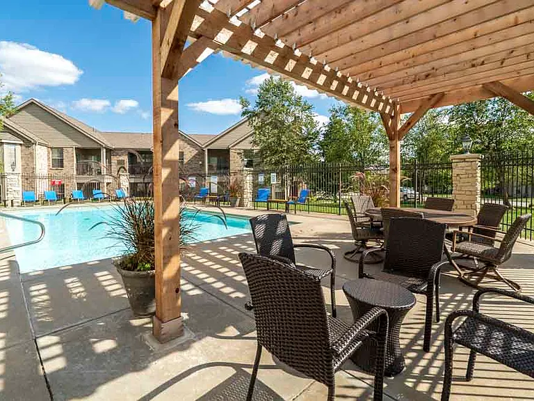 Relax under our pergola with stunning pool views.