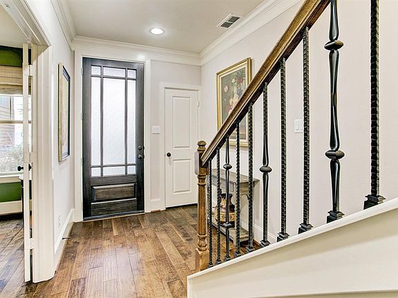 The decorative front door makes a stately statement and allows tons of natural light into the foyer. There is also a coat closet in the entry.
