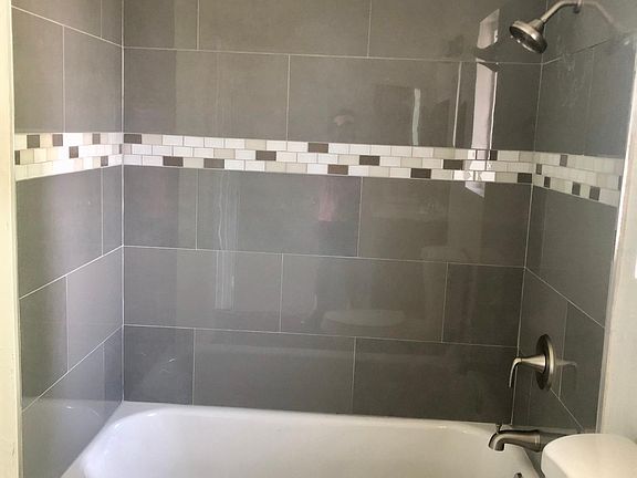 New bathtub with porcelain tiles