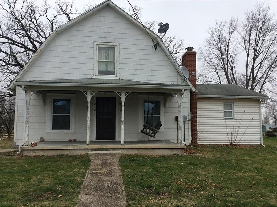 Front of home 1.5 story barn style with room addition on right side