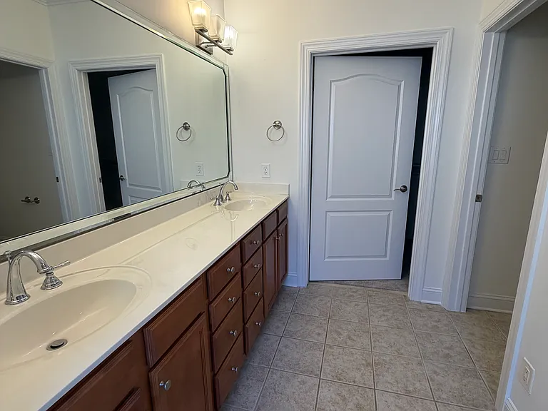 primary, door straight ahead is to the walk0in closet and door to right is to the toilet