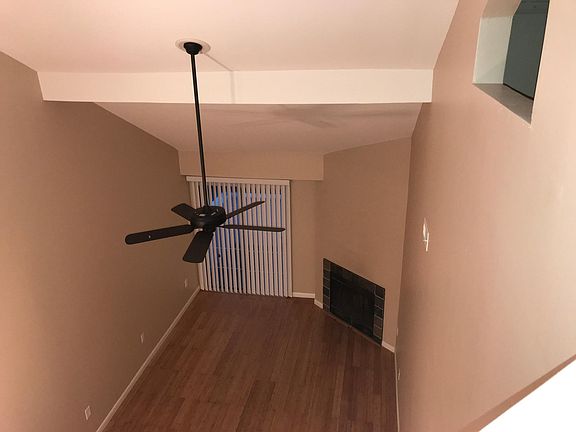 View from second floor to the great room with fire place