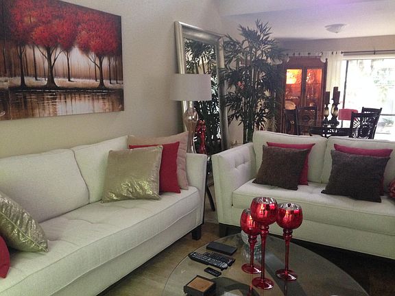 Living room in the foreground, dining room in the background