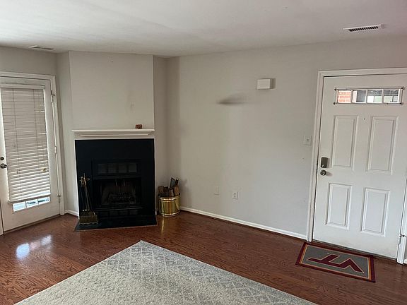 Living room with wood-burning fireplace