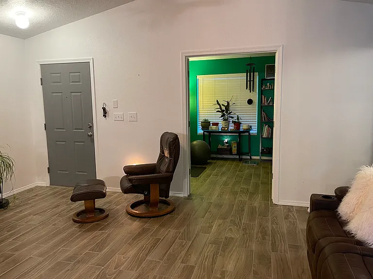 Living room looking into office and front door