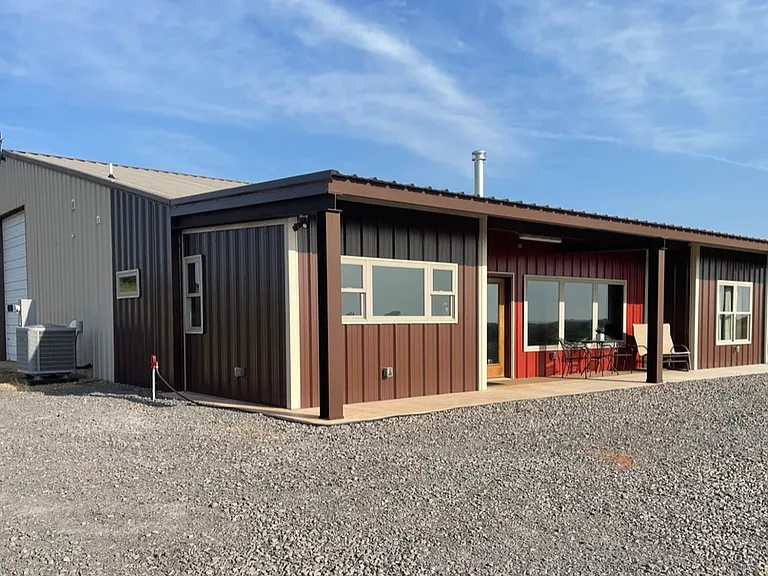 Front of barndominium with plenty of parking.
