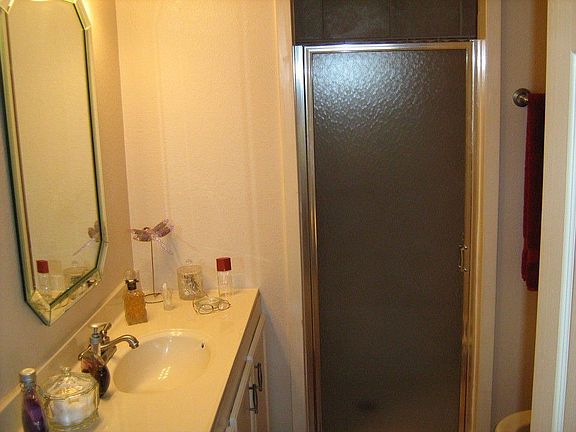 BATH ADJOINS BOTH BEDROOMS, LARGE WALK-IN SHOWER