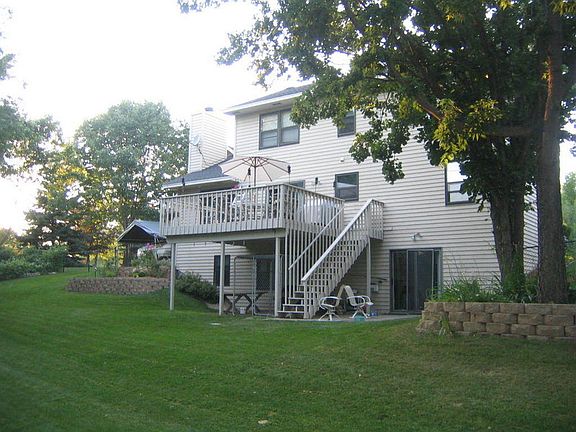 From the Deck looking over backyard/pond : Beautiful views of water, trees and a great yard