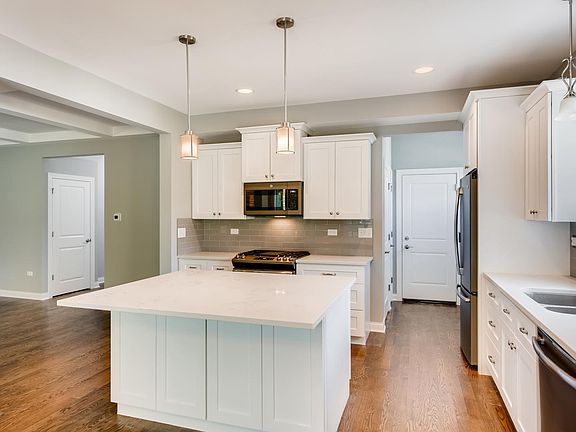 Granite counter tops, hardwood floors, stainless steel slate finish appliances