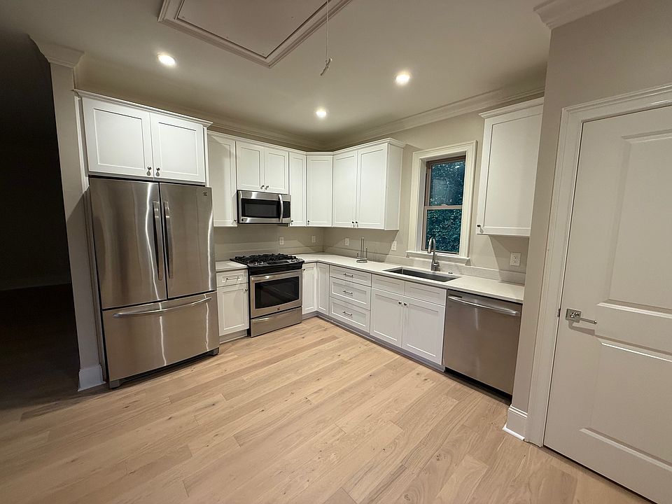 Full-size kitchen with dishwasher, gas range, microwave, refrigerator